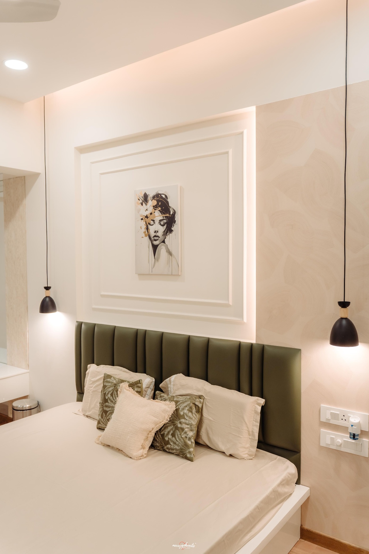 Completed master bedroom with olive tufted headboard and art niche