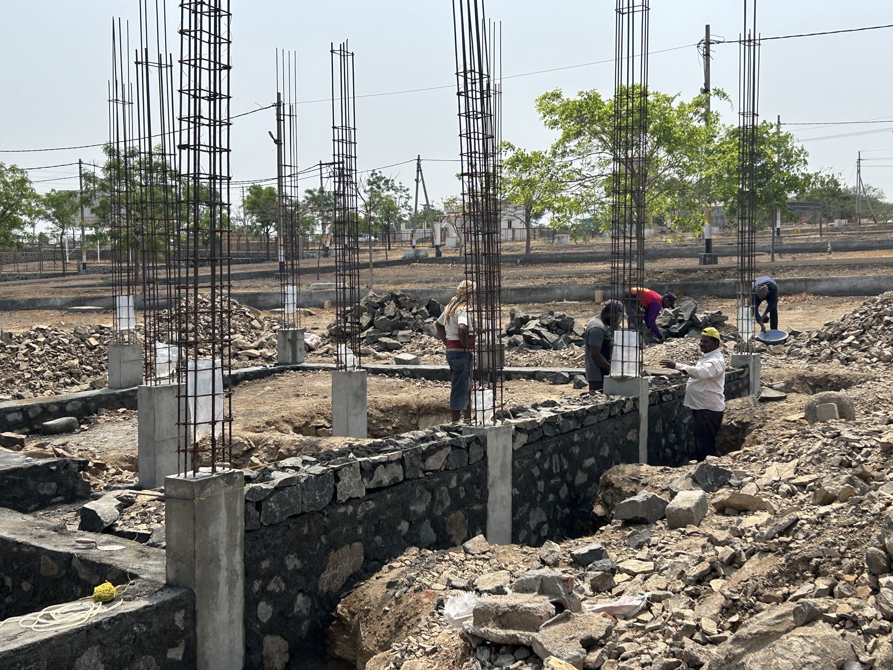 Construction site view of an independent house shell nearing completion